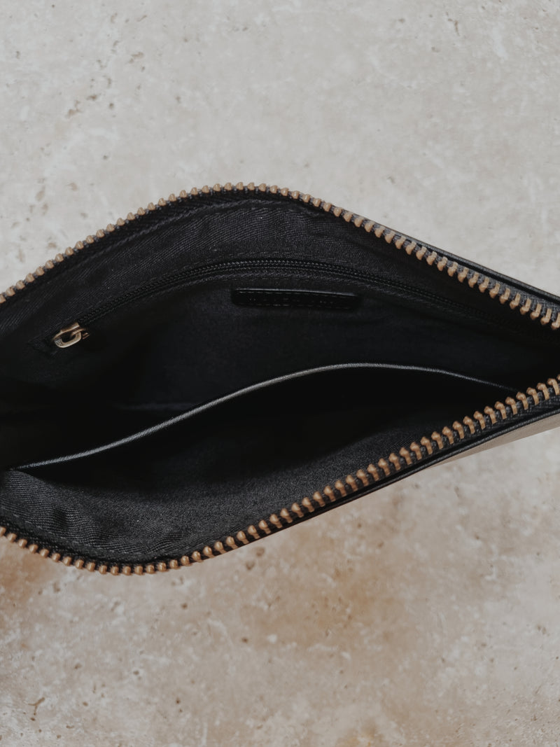 INSIDE VIEW OF BLACK VEGAN LEATHER CLUTCH